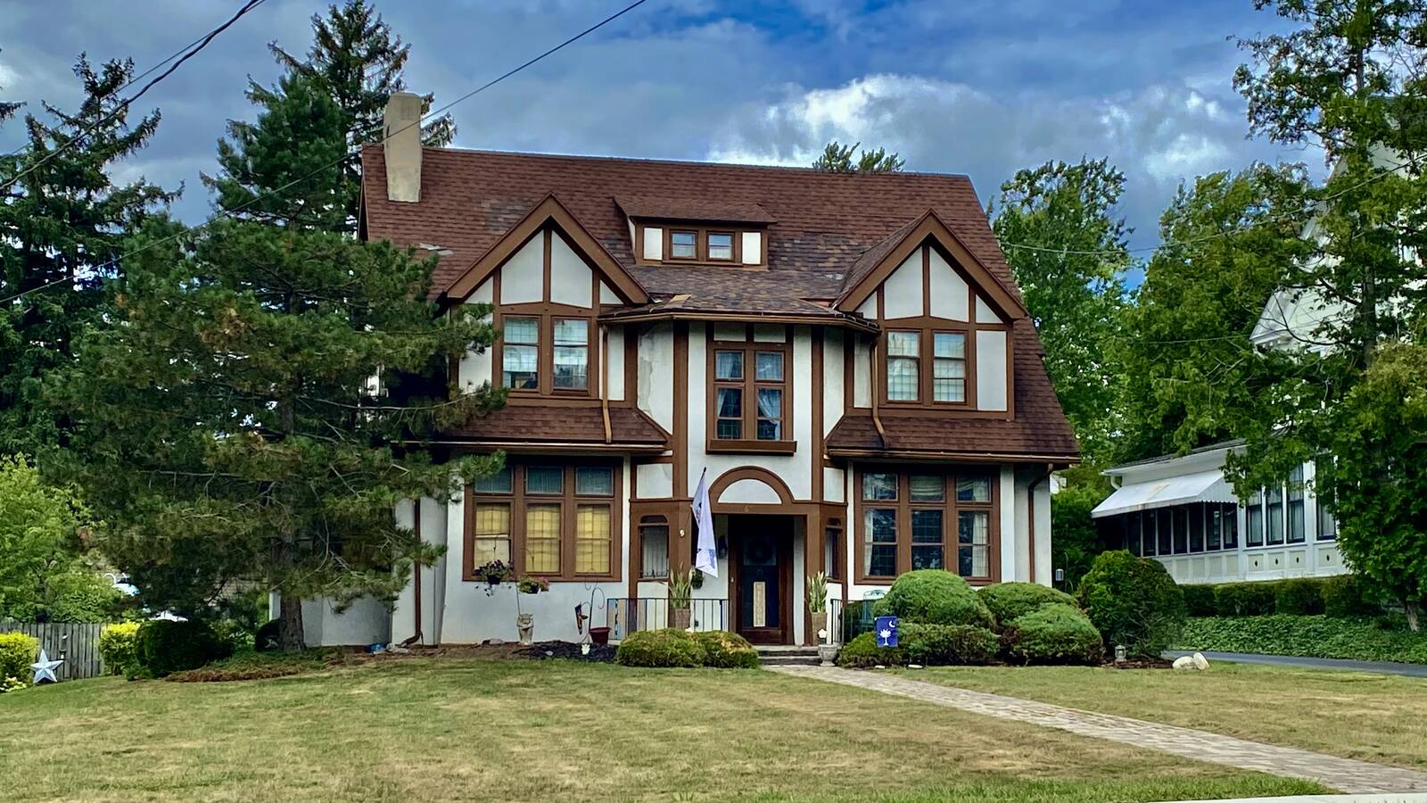 Older Batavia New York city home with porch and local Western New York housing character