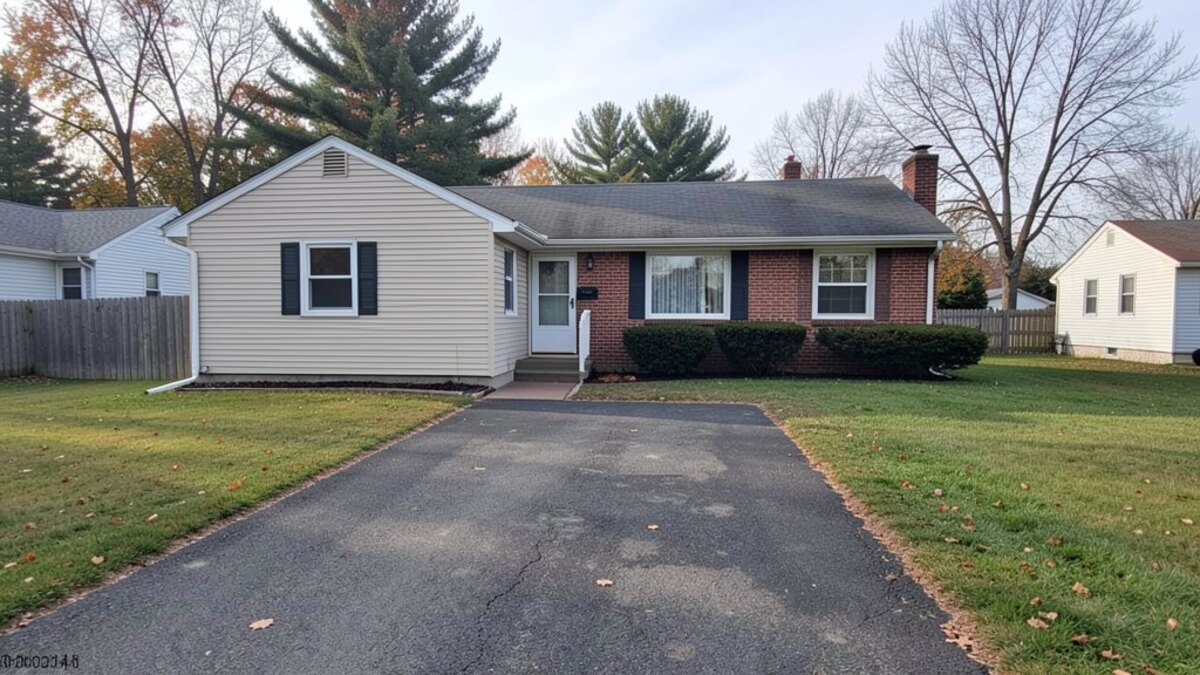 modest Corning New York ranch or bungalow with driveway and small yard